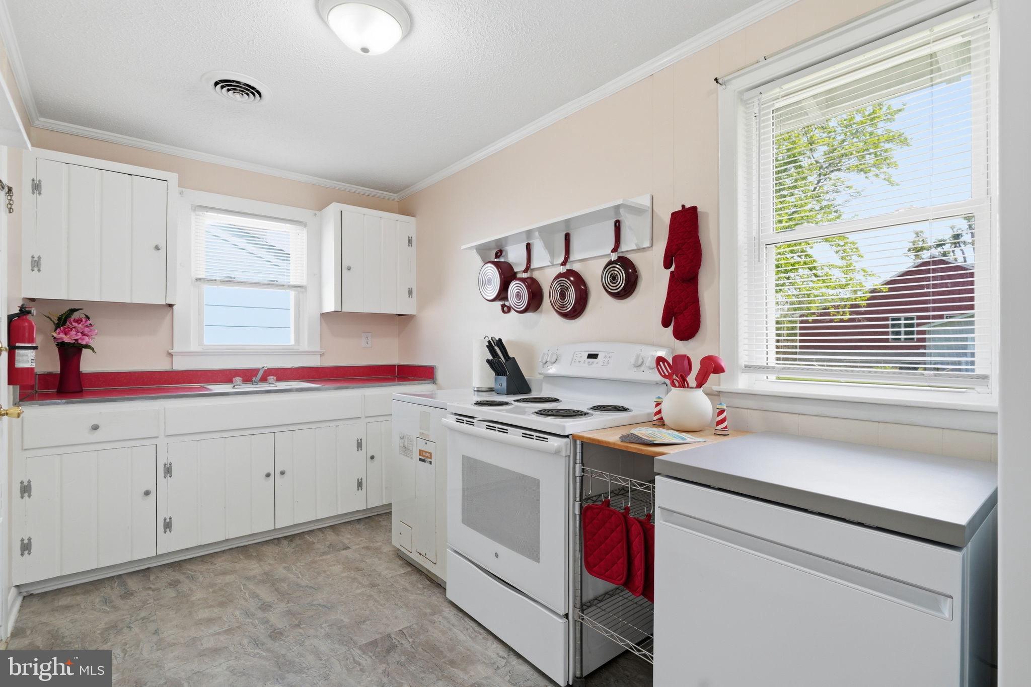 312 Vernon Street Colonial Beach, VA 22443 - Photo 22 of 45 a kitchen with a stove and a sink