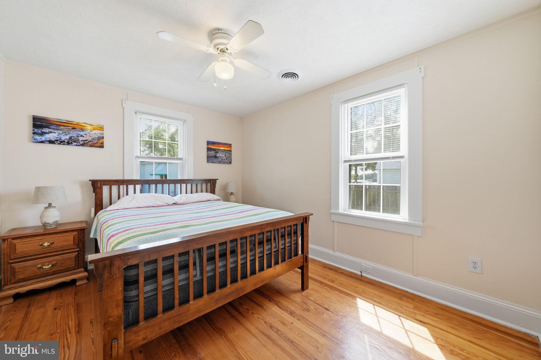312 Vernon Street Colonial Beach, VA 22443 - Photo 26 of 45 a bedroom with a bed next to a window