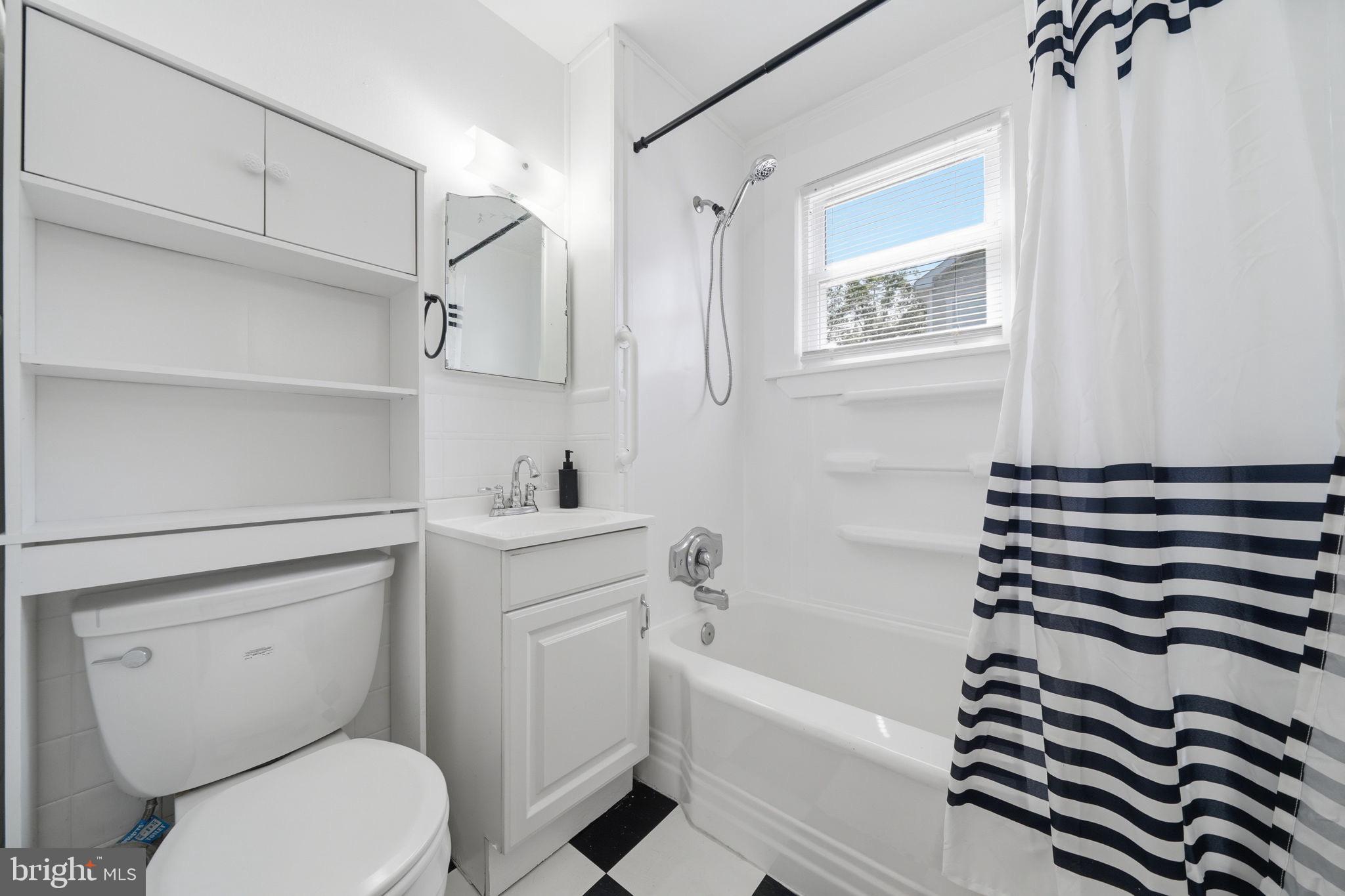 312 Vernon Street Colonial Beach, VA 22443 - Photo 28 of 45 a bathroom with a sink a toilet and a bathtub