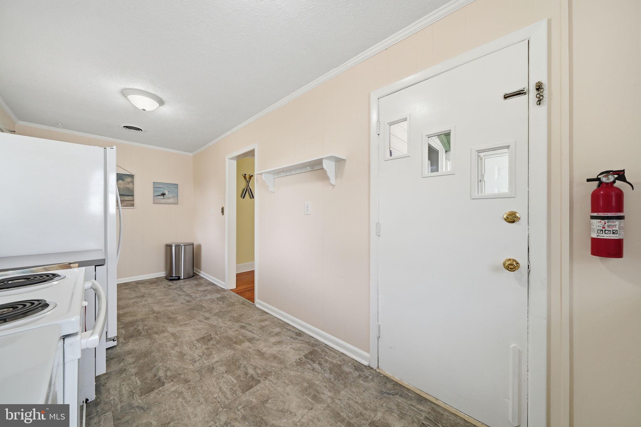 312 Vernon Street Colonial Beach, VA 22443 - Photo 29 of 45 a view of a hallway with closet and wooden floor