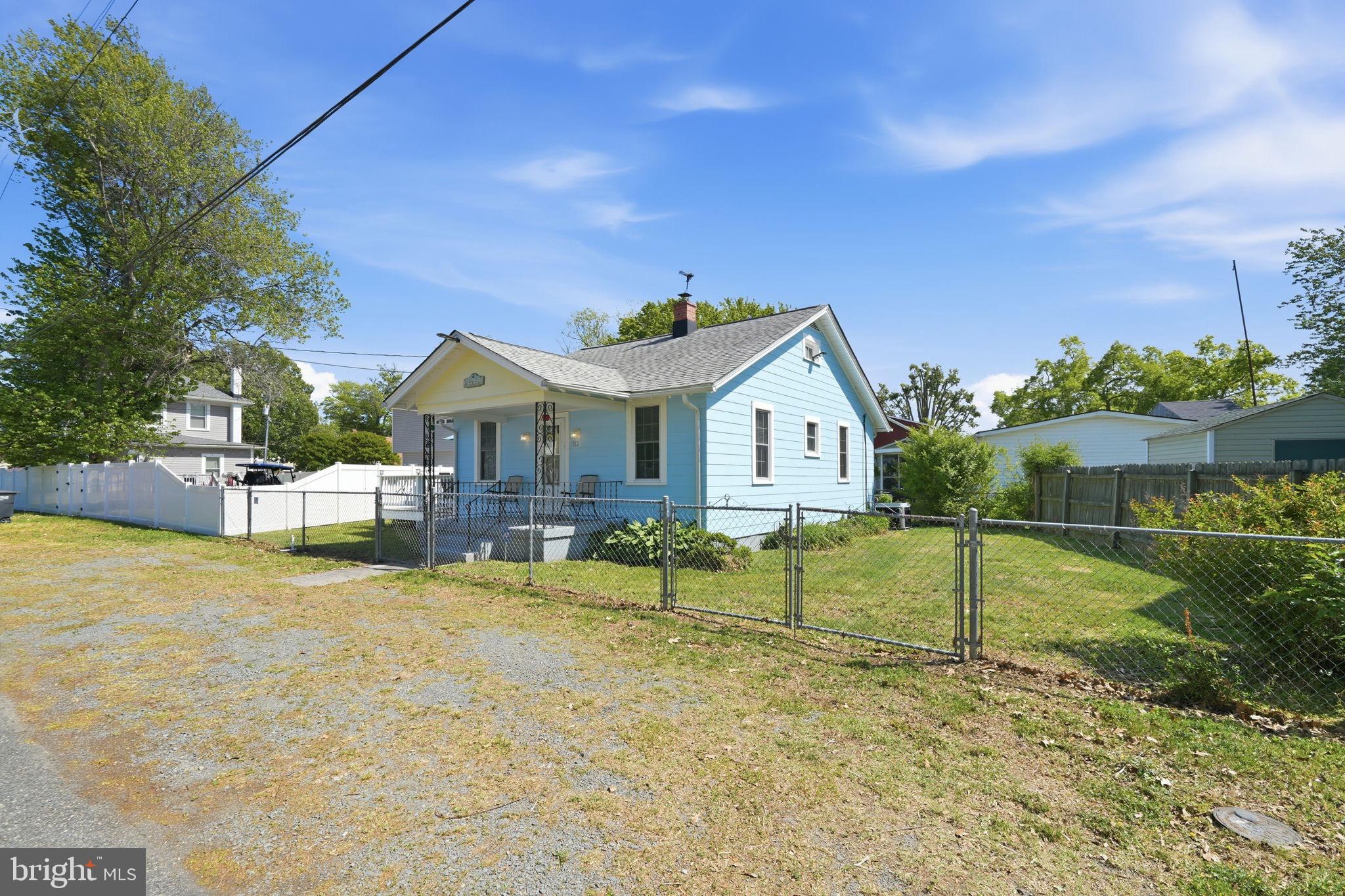 312 Vernon Street Colonial Beach, VA 22443 - Photo 5 of 45 a view of house with garden and swimming pool