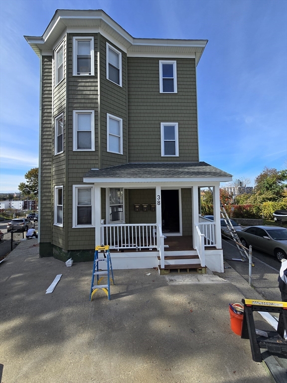 38 Fox Street, Unit 2 Worcester, MA 01604 - Photo 1 of 21 a front view of a house with a garage