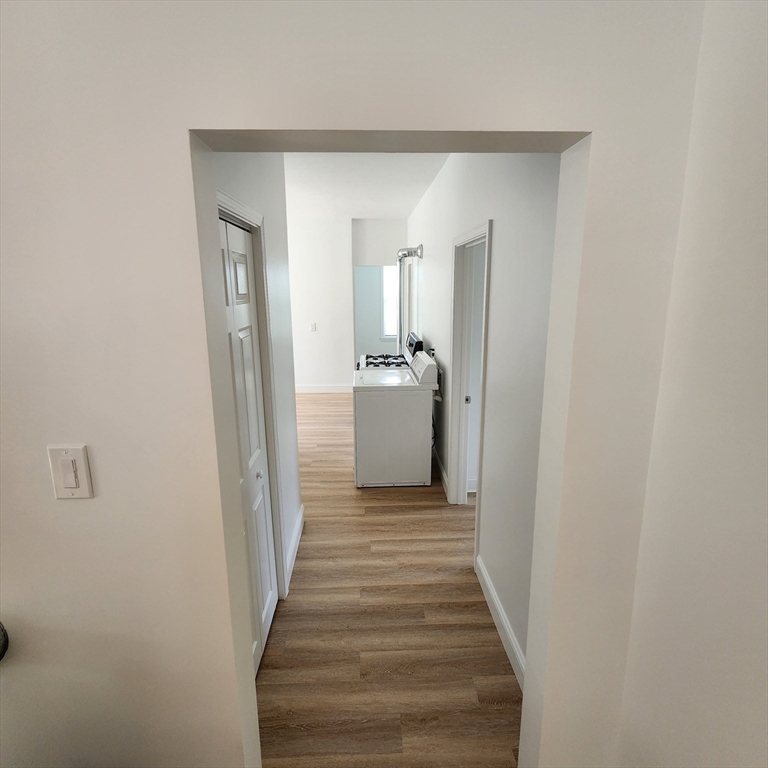38 Fox Street, Unit 2 Worcester, MA 01604 - Photo 13 of 21 a view of a hallway with wooden floor and staircase
