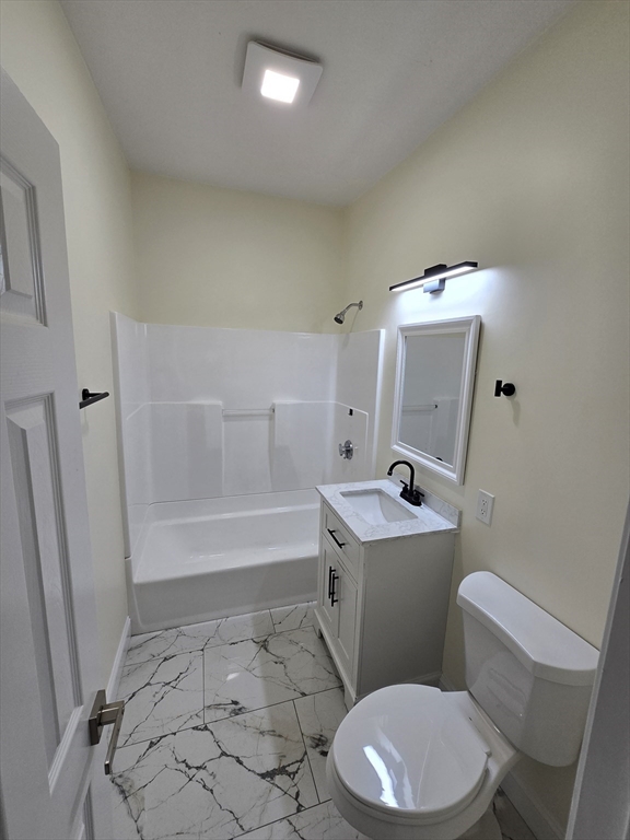 38 Fox Street, Unit 2 Worcester, MA 01604 - Photo 20 of 21 a bathroom with a sink a toilet and a bathtub