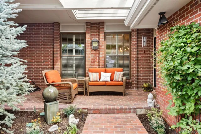 a outdoor living space with patio furniture and potted plants