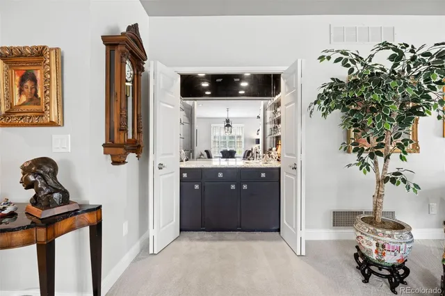 a living room with furniture potted plant and a window