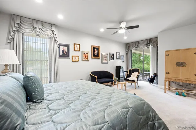 a bedroom with a large bed and a large window