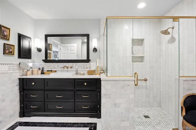 a bathroom with a sink double vanity and a mirror