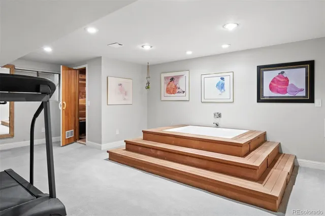 a spacious bedroom with a bed and a walk in closet