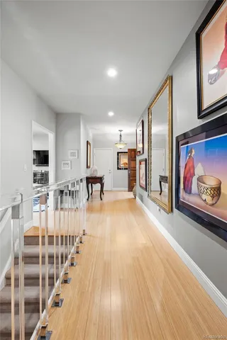 a view of a kitchen with furniture and wooden floor