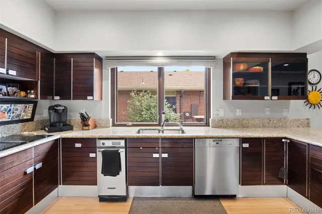 a kitchen with stainless steel appliances granite countertop a stove and a sink