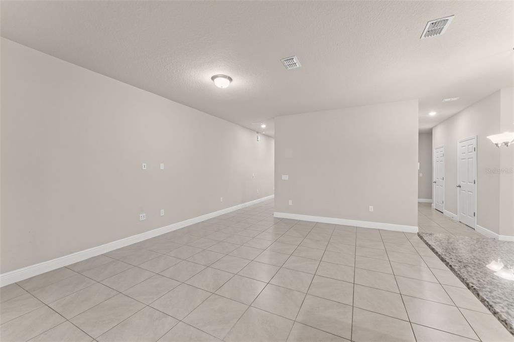 2224 Shadowland Loop Winter Park, FL 32792 - Photo 16 of 42 an empty room with white walls and tiles