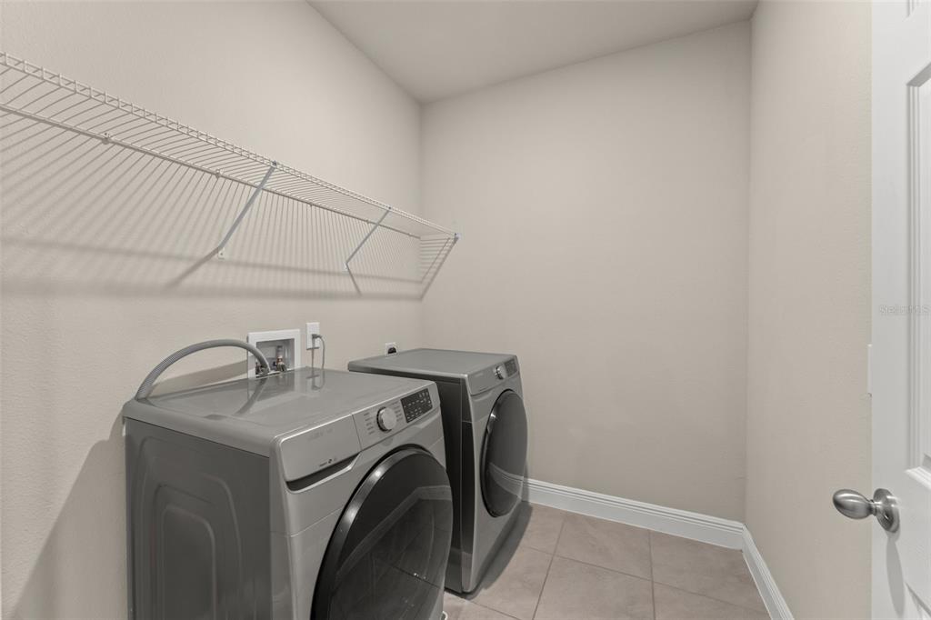 2224 Shadowland Loop Winter Park, FL 32792 - Photo 31 of 42 a utility room with dryer and washer