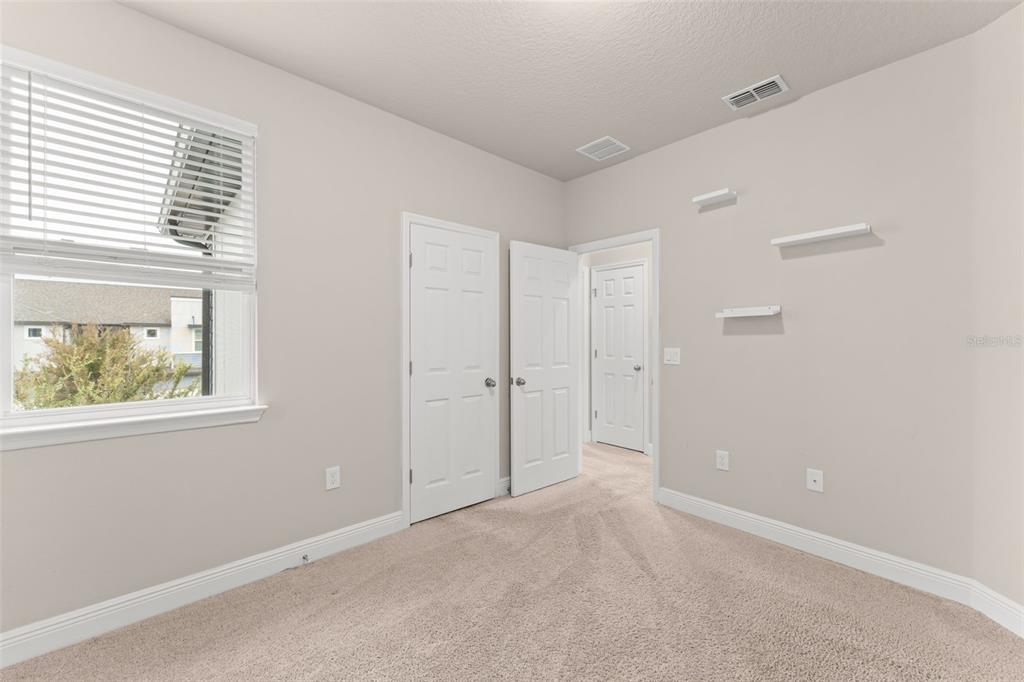 2224 Shadowland Loop Winter Park, FL 32792 - Photo 35 of 42 a view of an empty room with a window