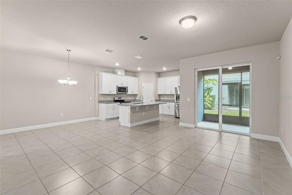 2224 Shadowland Loop Winter Park, FL 32792 - Photo 6 of 42 a view of kitchen with white cabinets
