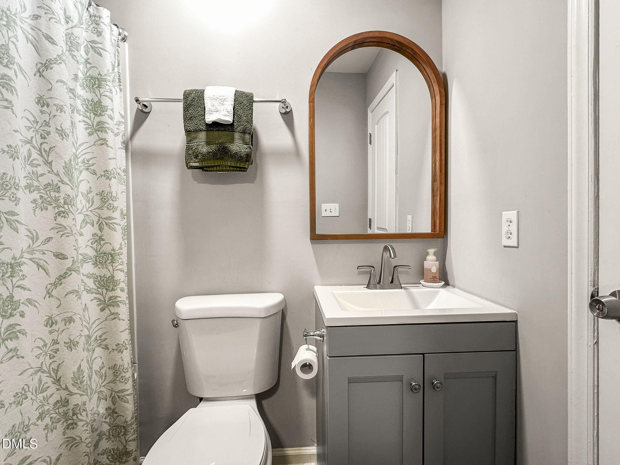 1019 Parkthrough Street Cary, NC 27511 - Photo 11 of 23 a bathroom with a toilet sink and mirror