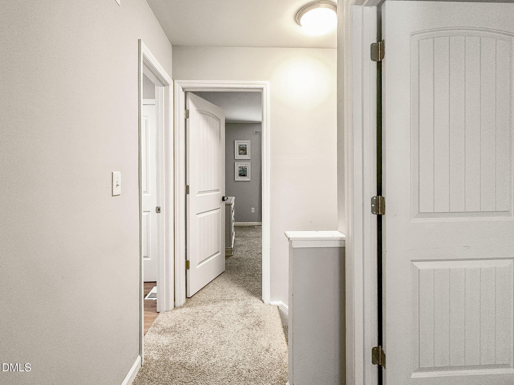 1019 Parkthrough Street Cary, NC 27511 - Photo 13 of 23 a view of a bathroom with a glass door and mirror