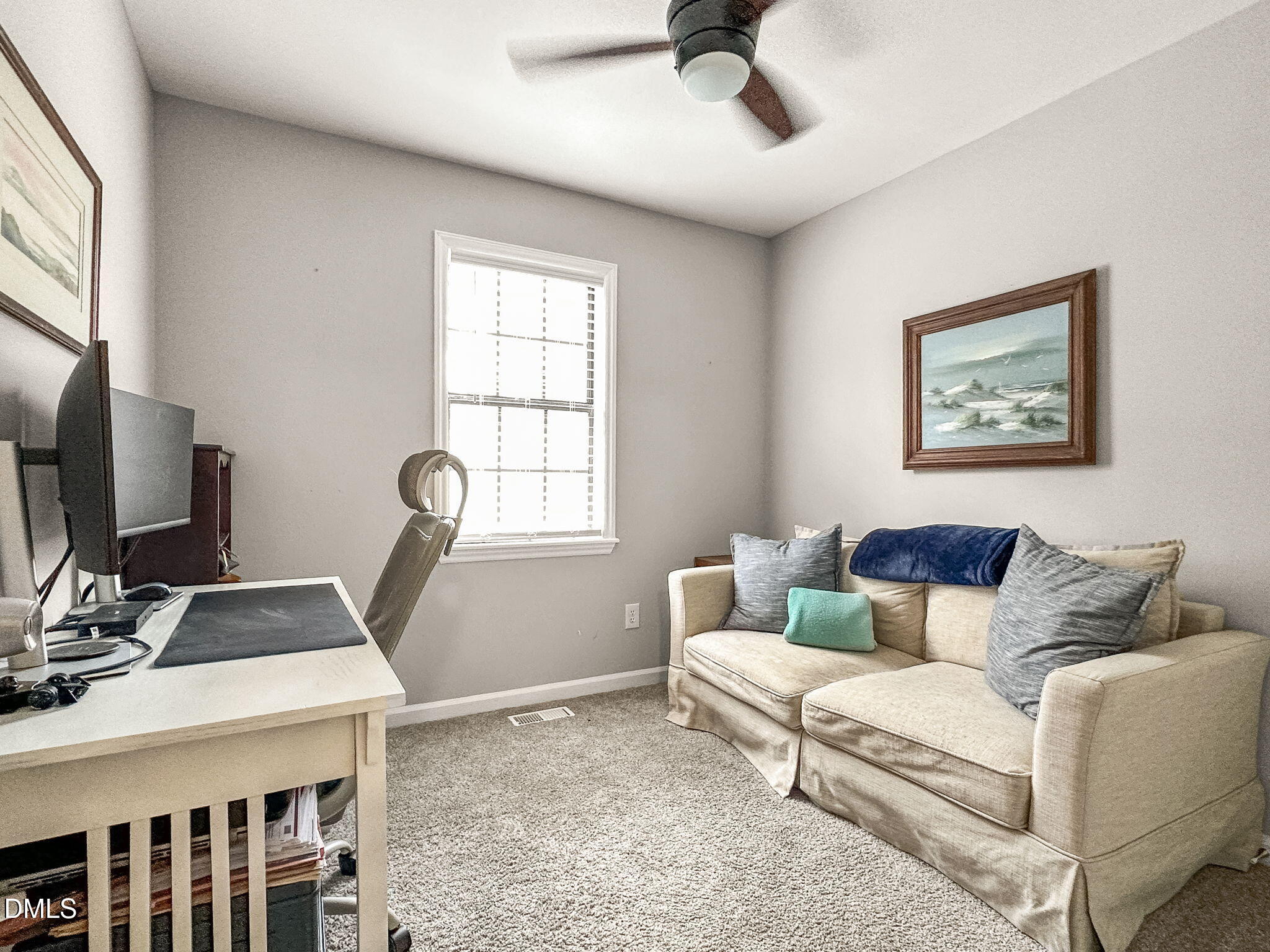1019 Parkthrough Street Cary, NC 27511 - Photo 14 of 23 a living room with furniture and a flat screen tv