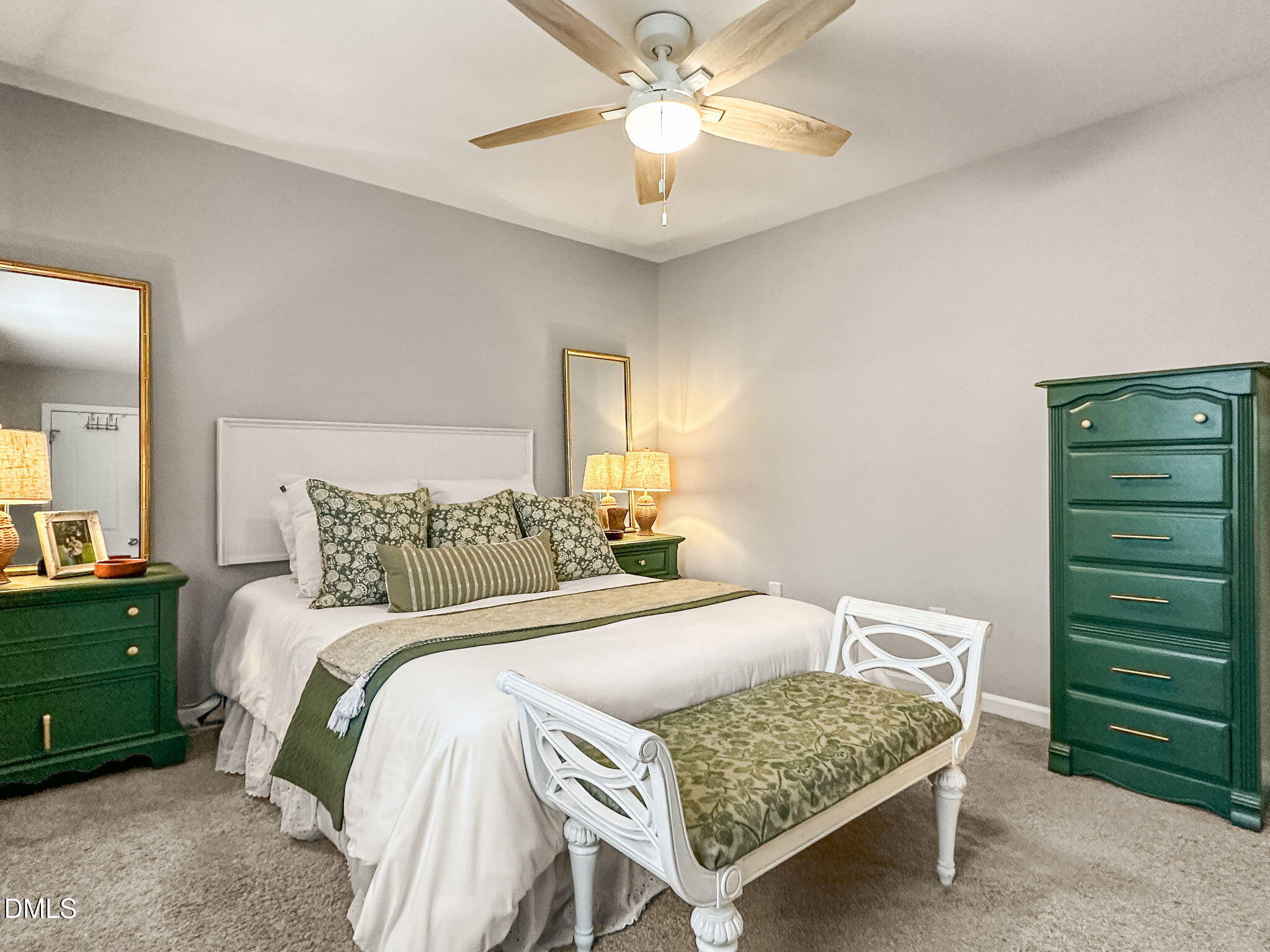 1019 Parkthrough Street Cary, NC 27511 - Photo 17 of 23 a bedroom with a bed and a chandelier