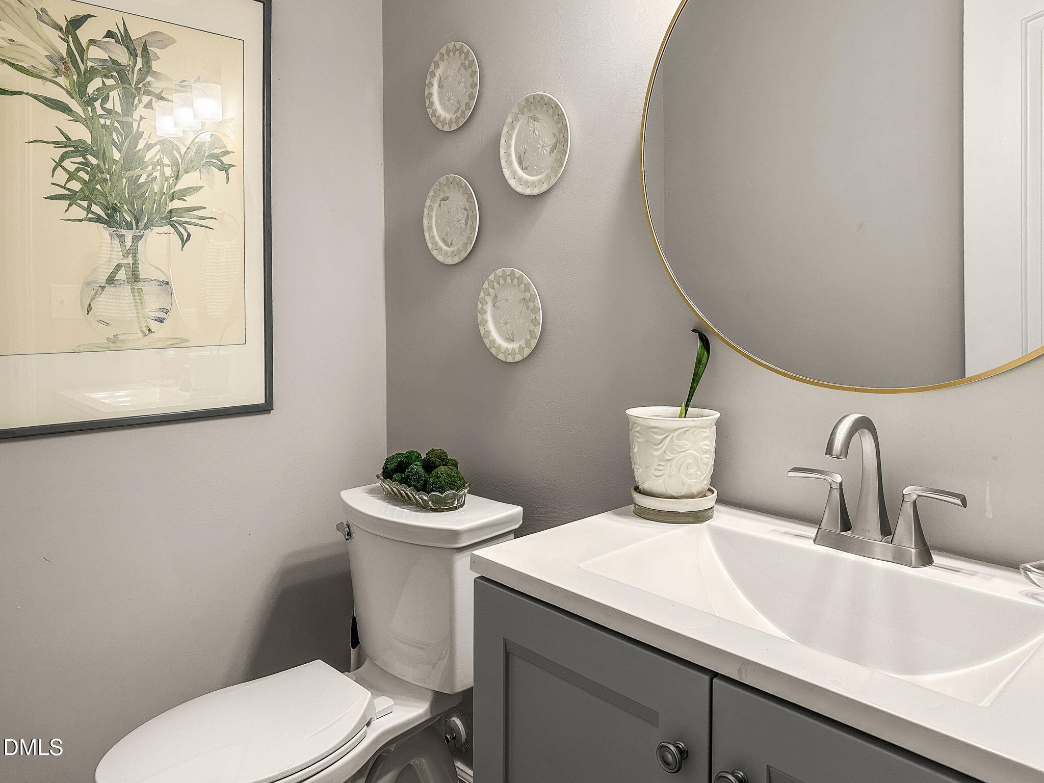 1019 Parkthrough Street Cary, NC 27511 - Photo 18 of 23 a bathroom with a toilet a sink and mirror