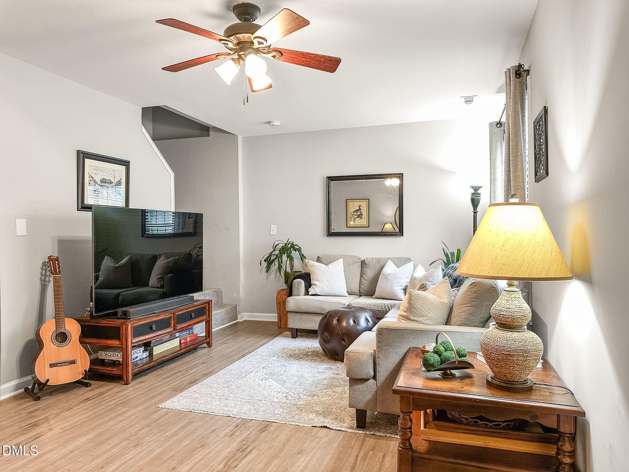 1019 Parkthrough Street Cary, NC 27511 - Photo 2 of 23 a living room with furniture and a flat screen tv