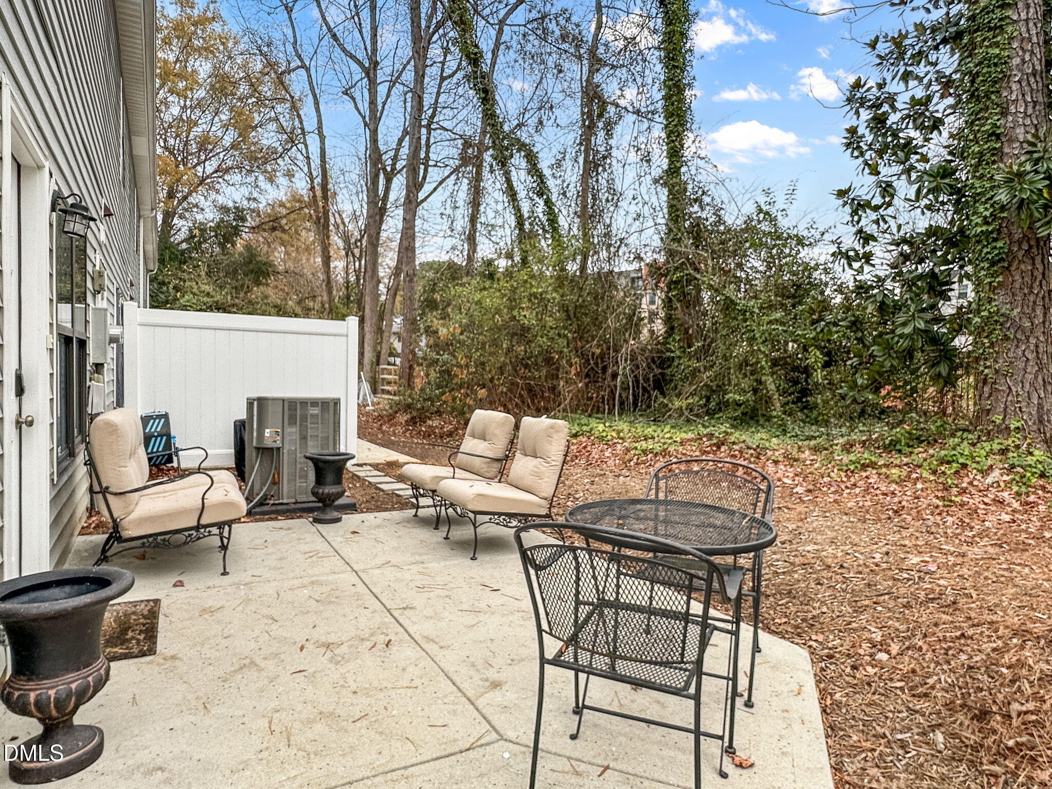 1019 Parkthrough Street Cary, NC 27511 - Photo 21 of 23 a view of backyard with seating area and trees