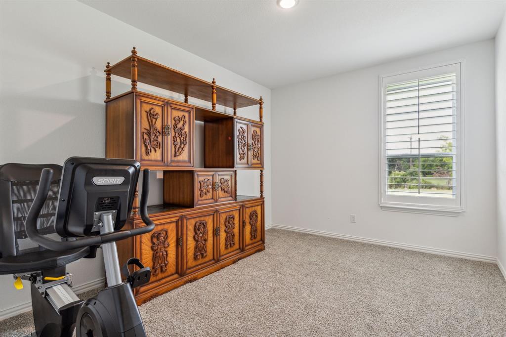 2410 Black Jack Oak Road Terrell, TX 75161 - Photo 23 of 31 Secondary bedroom #1 with carpet floors and baseboards