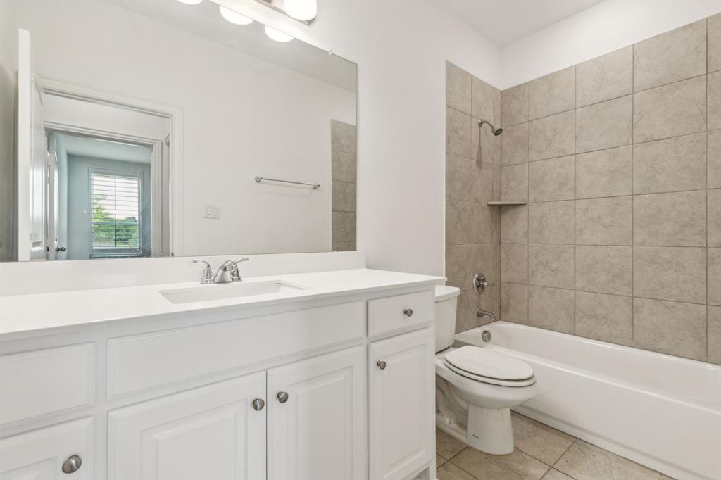 2410 Black Jack Oak Road Terrell, TX 75161 - Photo 25 of 31 Secondary bathroom featuring vanity, toilet, shower / bath combination, and tile patterned floors