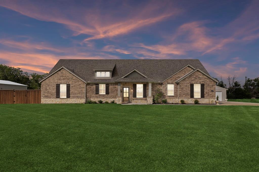 2410 Black Jack Oak Road Terrell, TX 75161 - Photo 28 of 31 View of front facade featuring brick siding, a front lawn, and a shingled roof