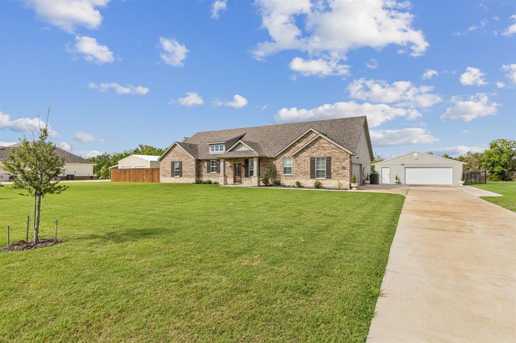 2410 Black Jack Oak Road Terrell, TX 75161 - Photo 31 of 31 View of front of property featuring brick siding, concrete driveway, roof with shingles, and a detached garage