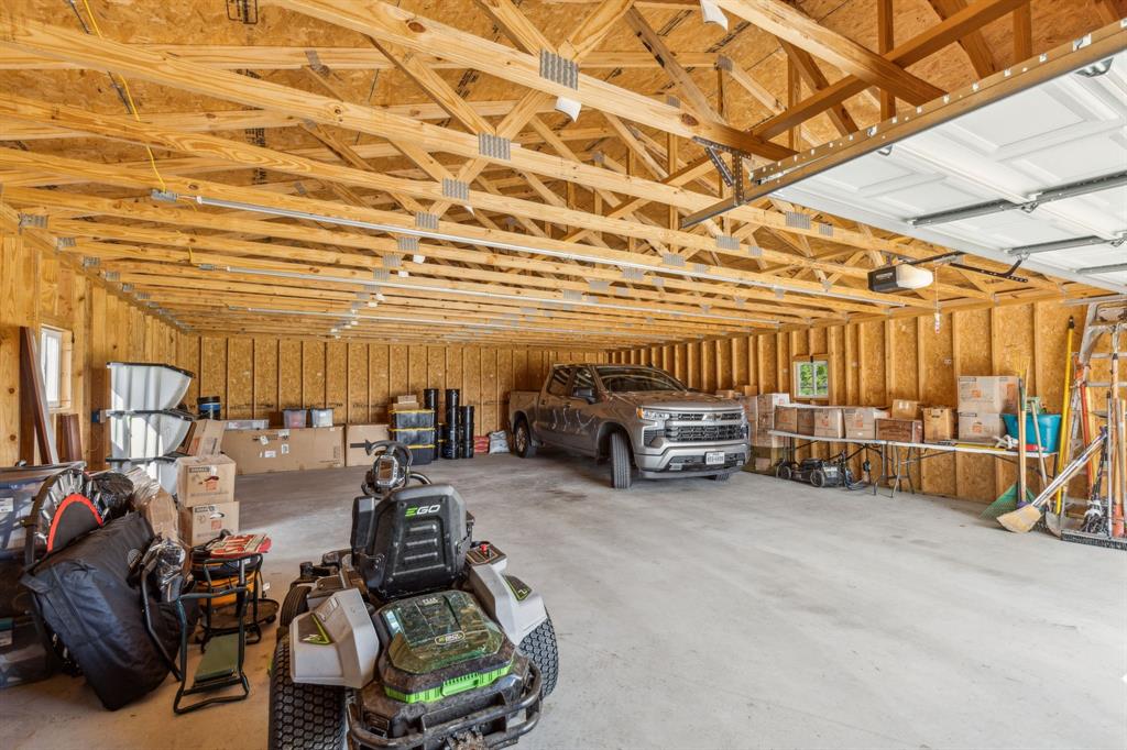 2410 Black Jack Oak Road Terrell, TX 75161 - Photo 5 of 31 Garage featuring a garage door opener