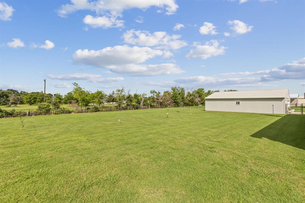 2410 Black Jack Oak Road Terrell, TX 75161 - Photo 6 of 31 View of green lawn featuring an outbuilding and an outdoor structure
