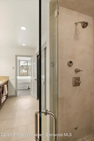a bathroom with a tub and a shower