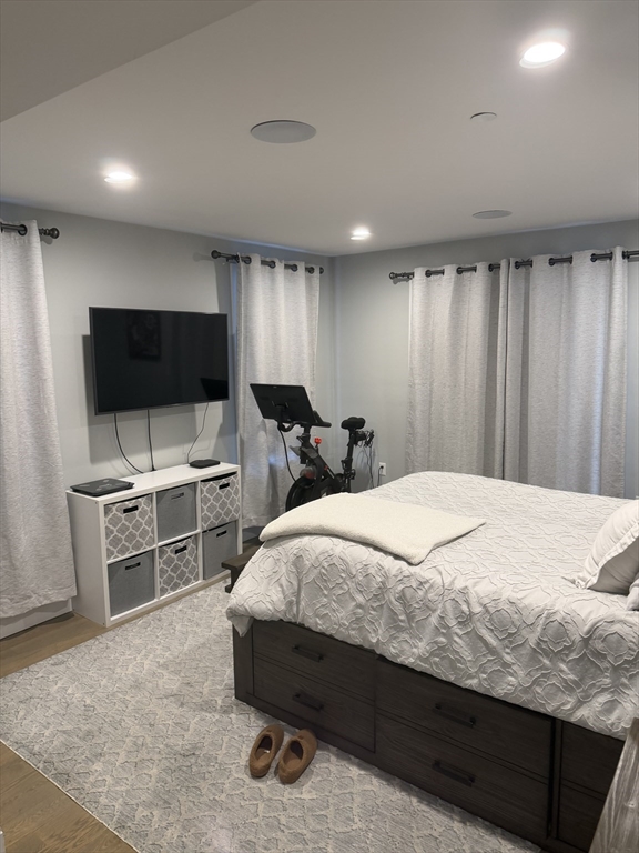 7 Saco Street, Unit 5 Boston, MA 02122 - Photo 12 of 15 a bedroom with a bed and a flat screen tv