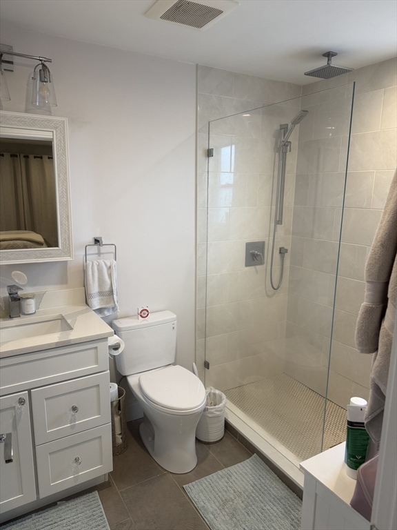 7 Saco Street, Unit 5 Boston, MA 02122 - Photo 13 of 15 a bathroom with a sink a toilet and shower