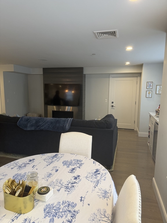 7 Saco Street, Unit 5 Boston, MA 02122 - Photo 2 of 15 a bedroom with a bed and wooden floor