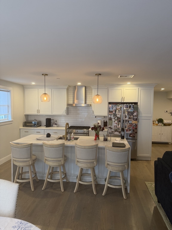 7 Saco Street, Unit 5 Boston, MA 02122 - Photo 3 of 15 a kitchen with a dining table chairs and view kitchen