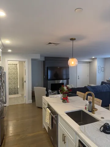 a kitchen with a sink and a stove
