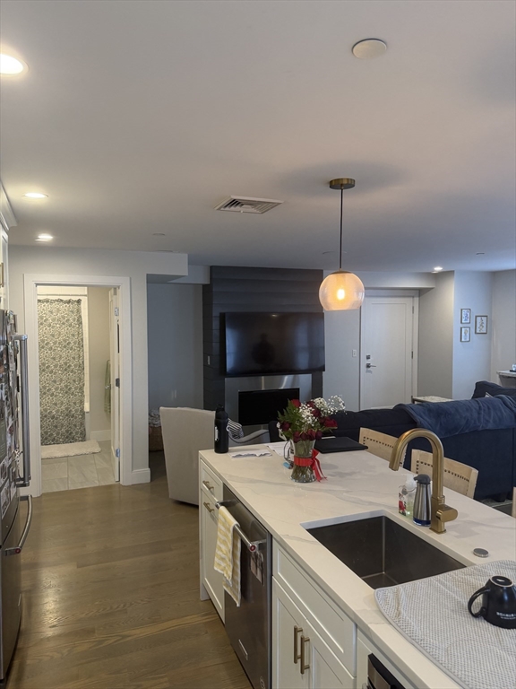 7 Saco Street, Unit 5 Boston, MA 02122 - Photo 4 of 15 a kitchen with a sink and a stove