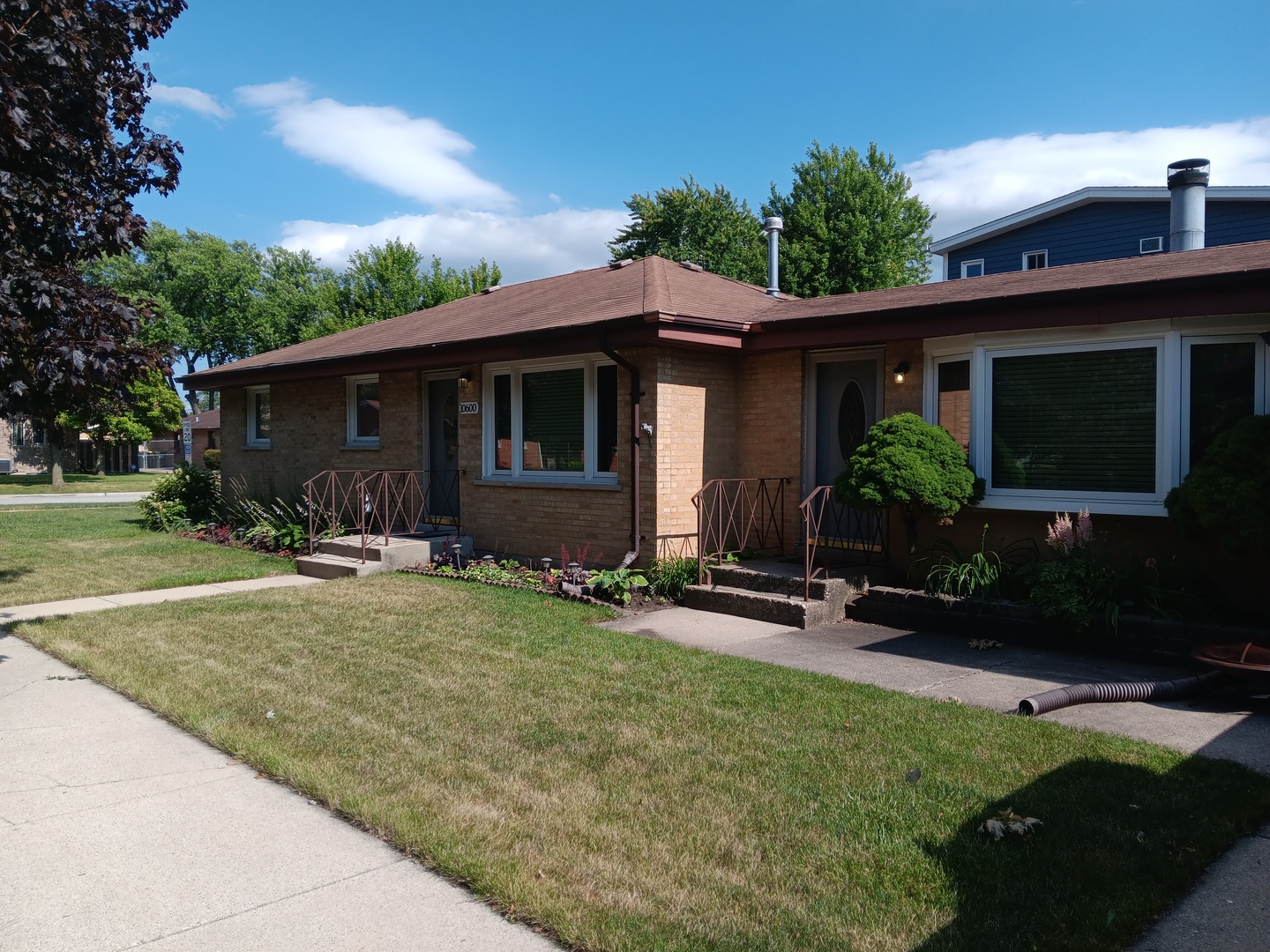 10600 Oak Avenue Chicago Ridge, IL 60415 - Photo 1 of 25 a front view of house with yard and outdoor seating