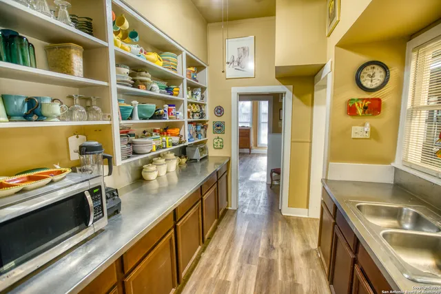 a kitchen with stainless steel appliances granite countertop a stove and a sink
