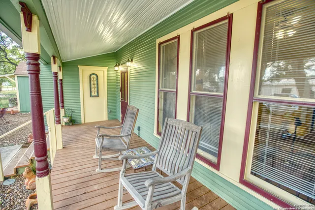 a view of a balcony with chairs