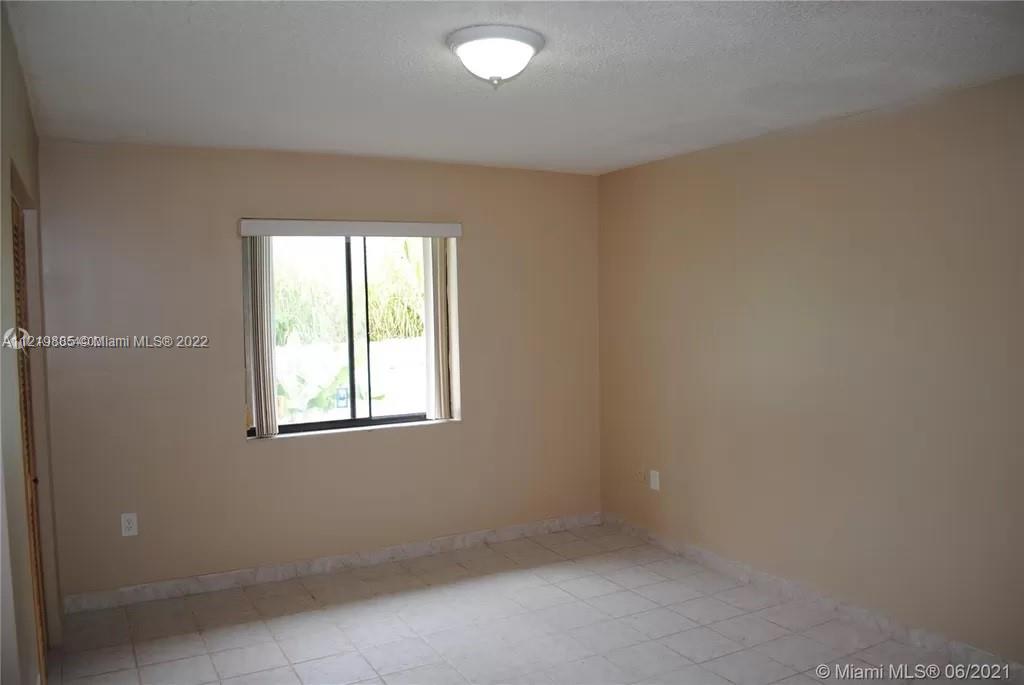 14006 Southwest 281st Terrace Homestead, FL 33033 - Photo 3 of 5 an empty room with a window