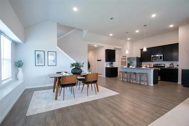 a view of kitchen with cabinets and wooden floor