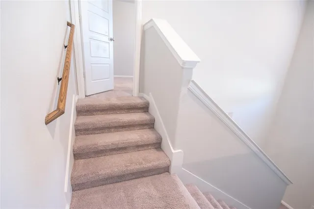 a view of kitchen with cabinets