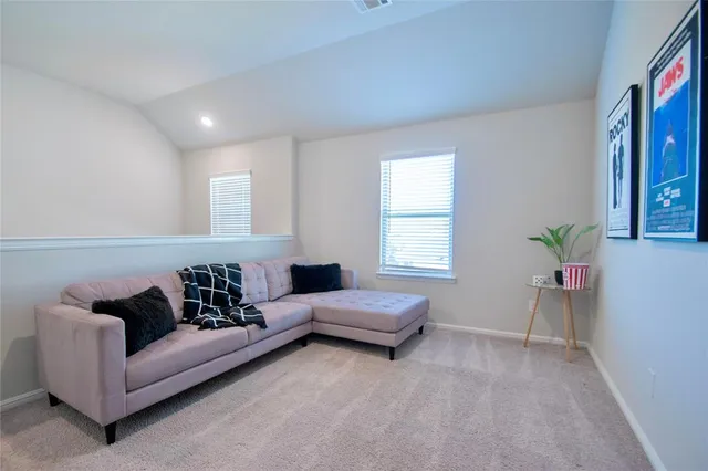 a living room with furniture and a window