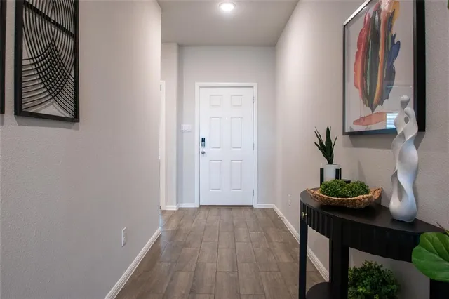 a view of front door with wooden floor