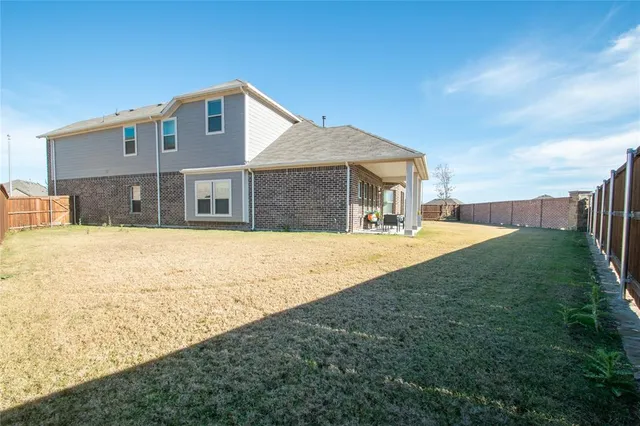 a bedroom with a bed and a potted plant