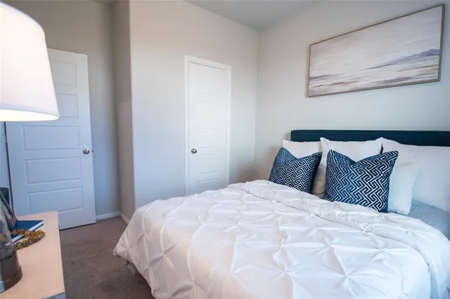 a large white bed in a white room