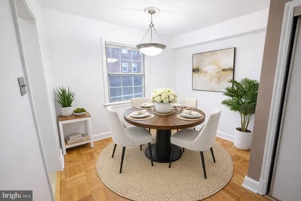 a view of a dining room with furniture and wooden floor